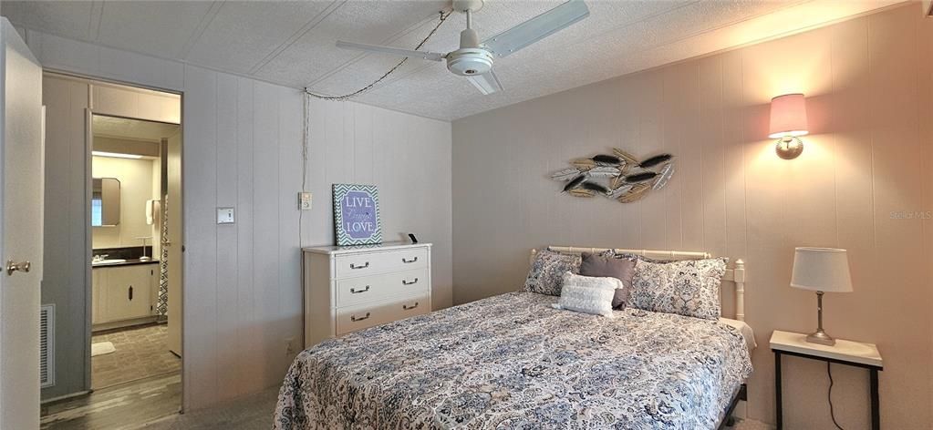 Guest bedroom includes ceiling fan & walk-in closet