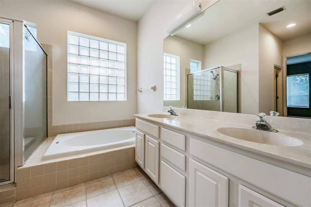 Master Bathroom with double vanities, separate shower and tub.