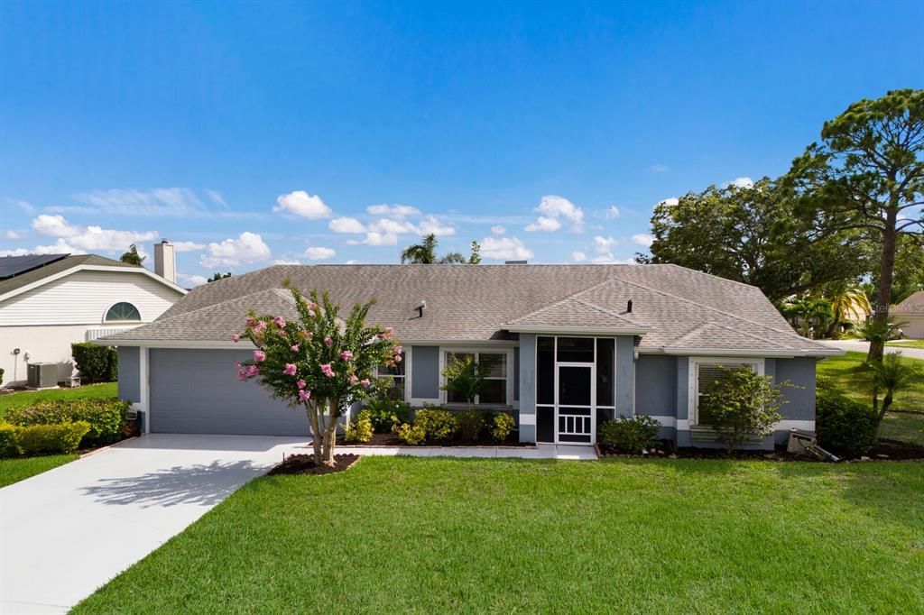 Oversized corner lot with welcoming screened-in front porch.