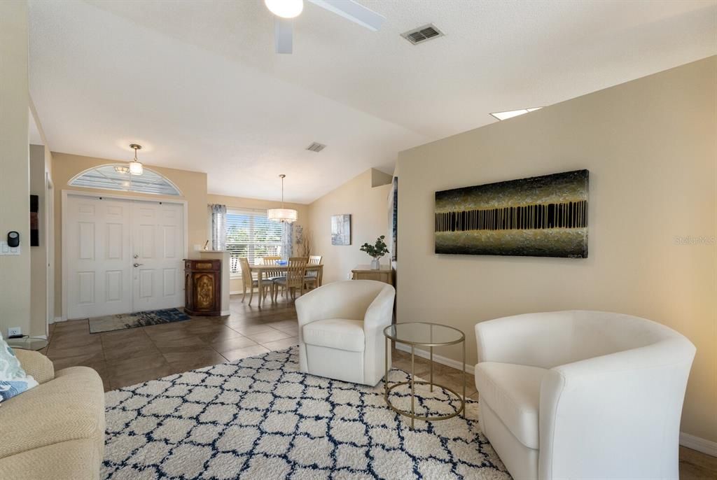 Large foyer entry opening to the formal dining and living room.