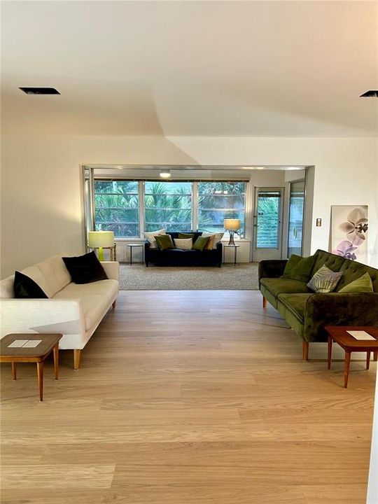 Foyer opens into the Great Room, which flows into the Sunroom. Split Bedrooms are to the left and right sides of the Great Room