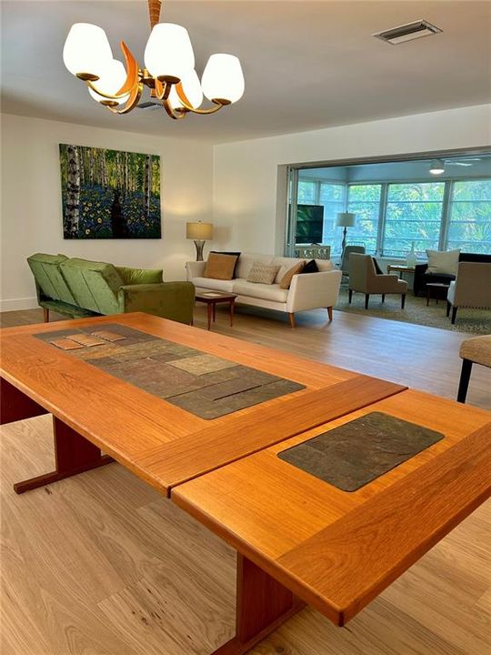 Dining Area, looking across table into great room, with sunroom beyond