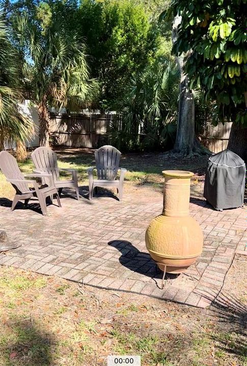 Patio area - "fireplace" and grill are virtually staged,