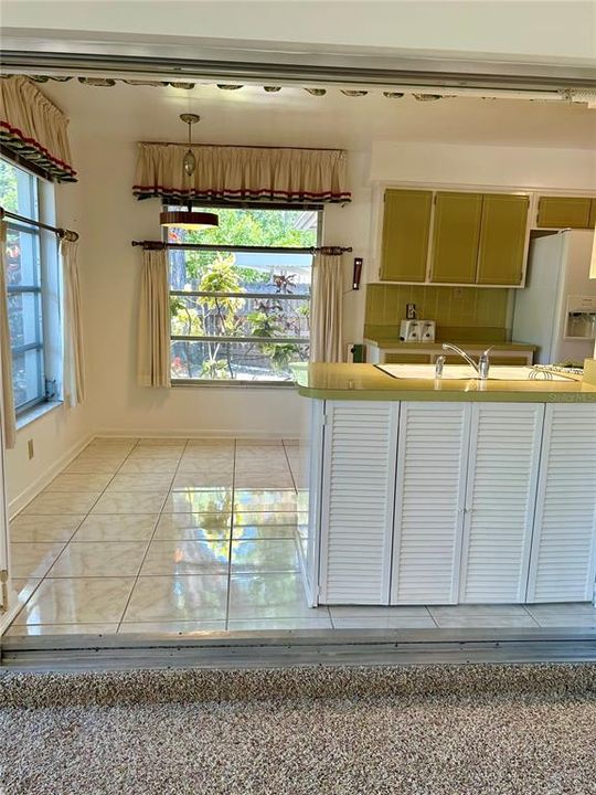 View from sunroom into kitchen/dinette space