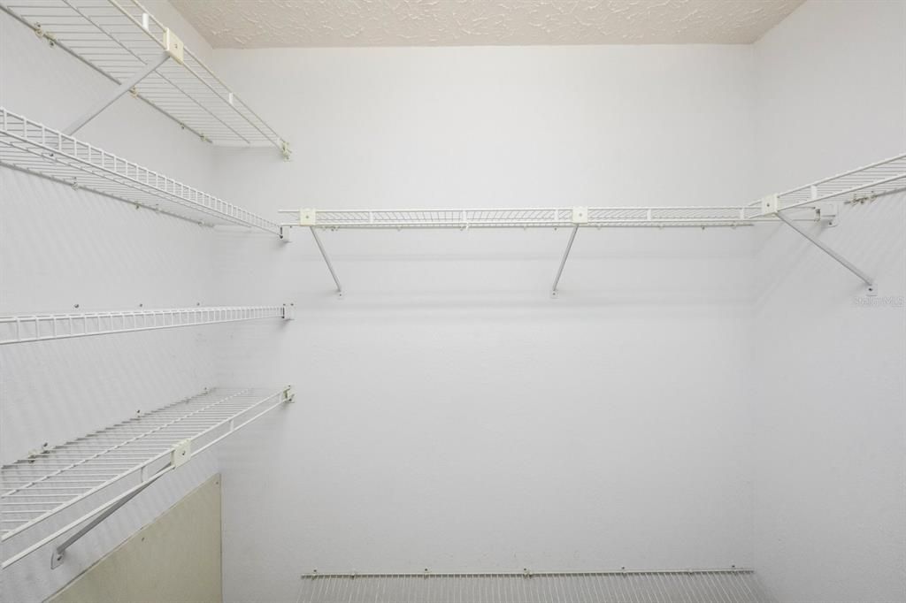 Walk in closet in primary bedroom