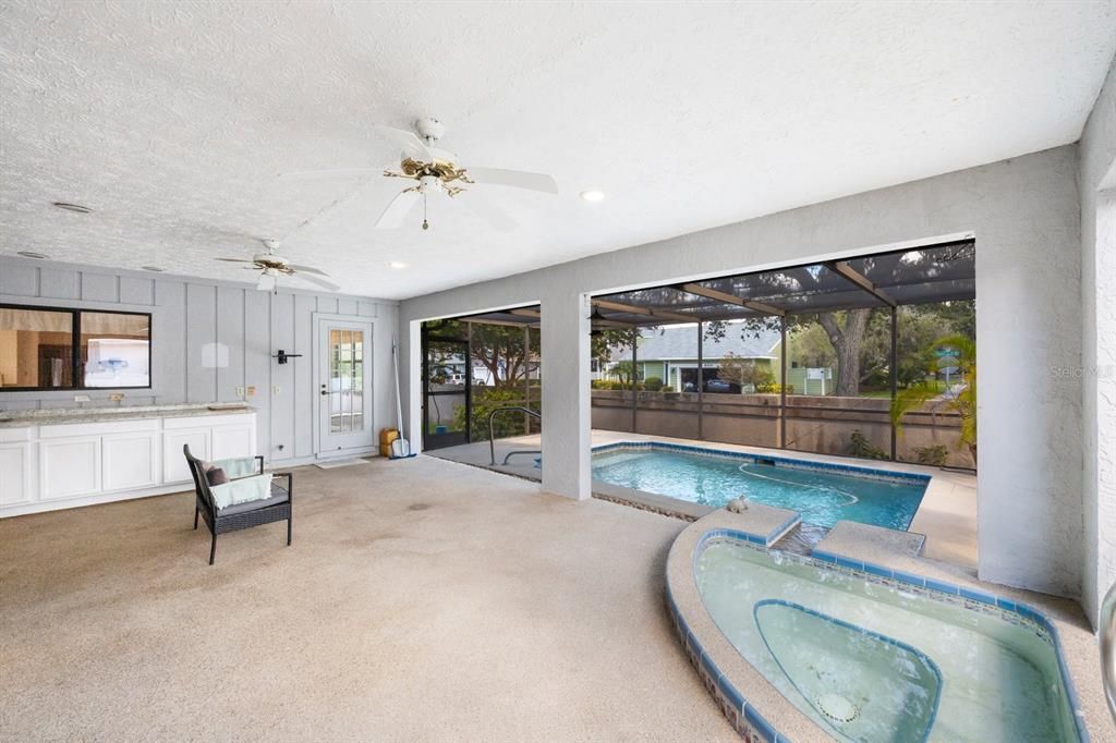 Large lanai with passthru window from kitchen