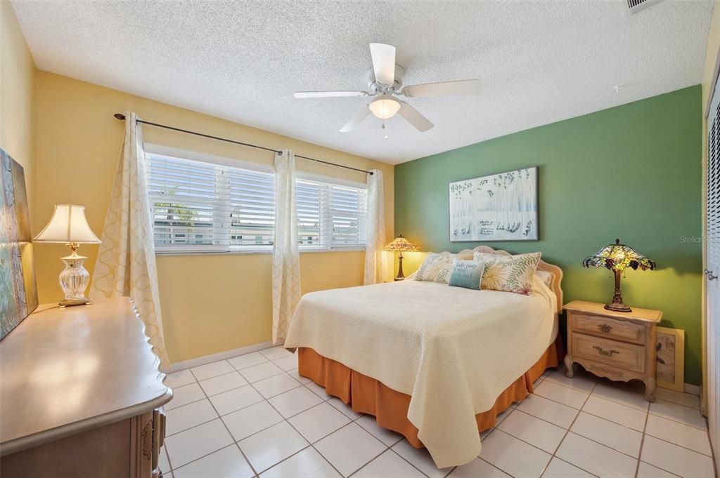 Guest bedroom has large windows!