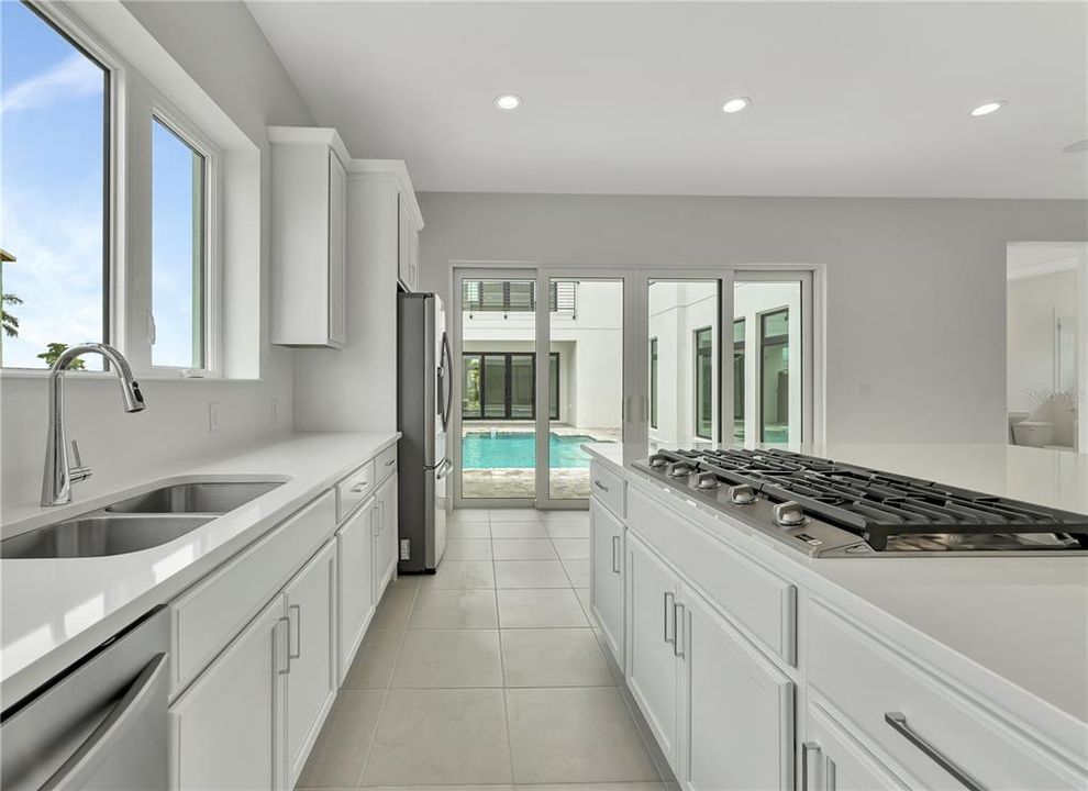 Kitchen w/ Pool Entrance