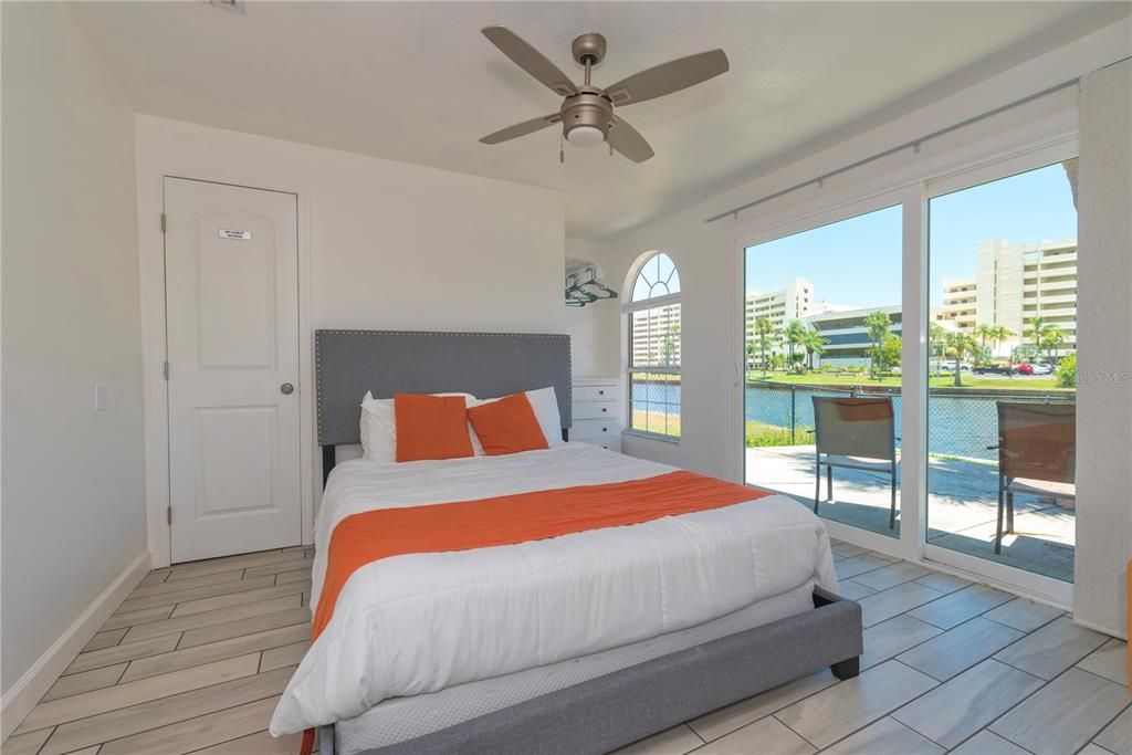 Third bedroom with water views and walk-in closet.