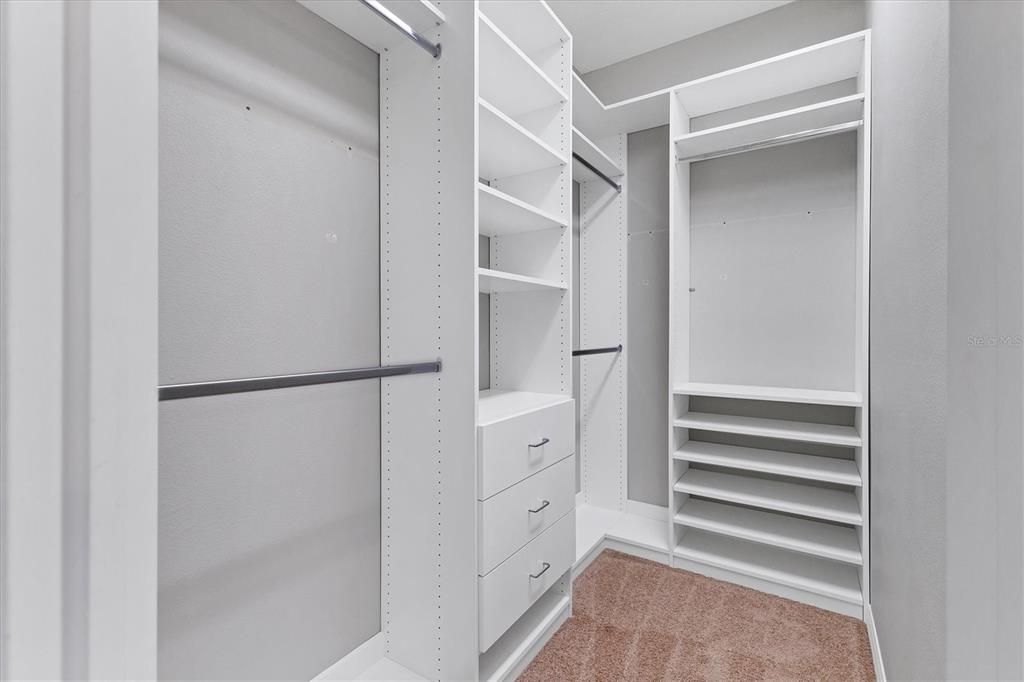 Professionally installed built-ins in both Primary Bedroom Walk-in Closets