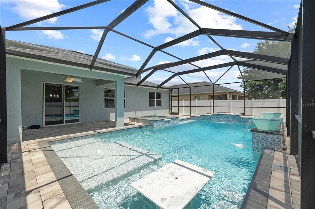 Pool with granite table and sun shelf