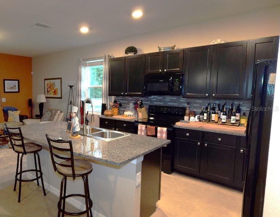 View of living room left side from the kitchen