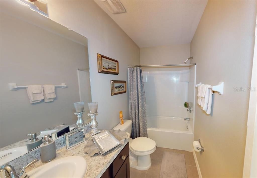 Jack & Jill bath from 2nd bedroom, features a linen closet not pictured