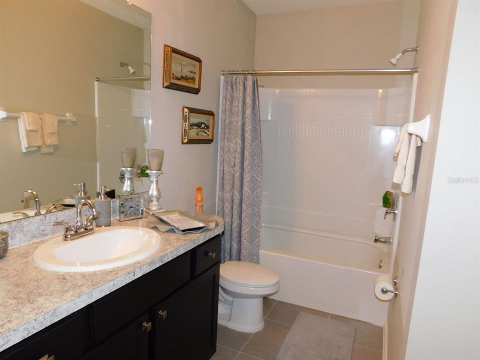 Jack & Jill bath from 2nd bedroom, features a linen closet not pictured