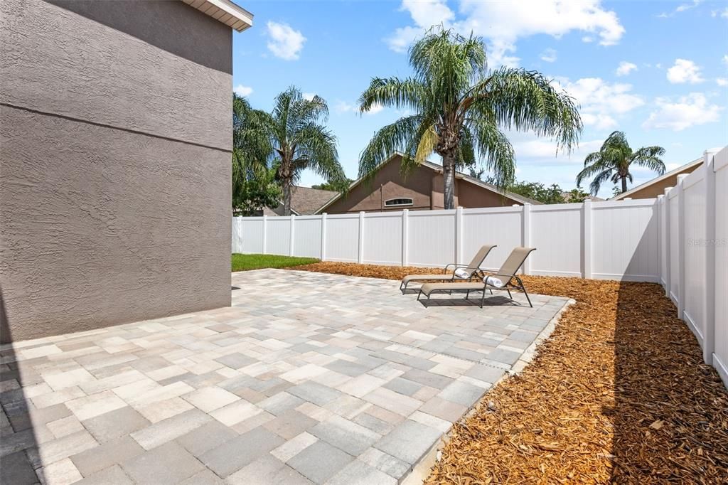 Fully Fenced Backyard with Extended Pavers