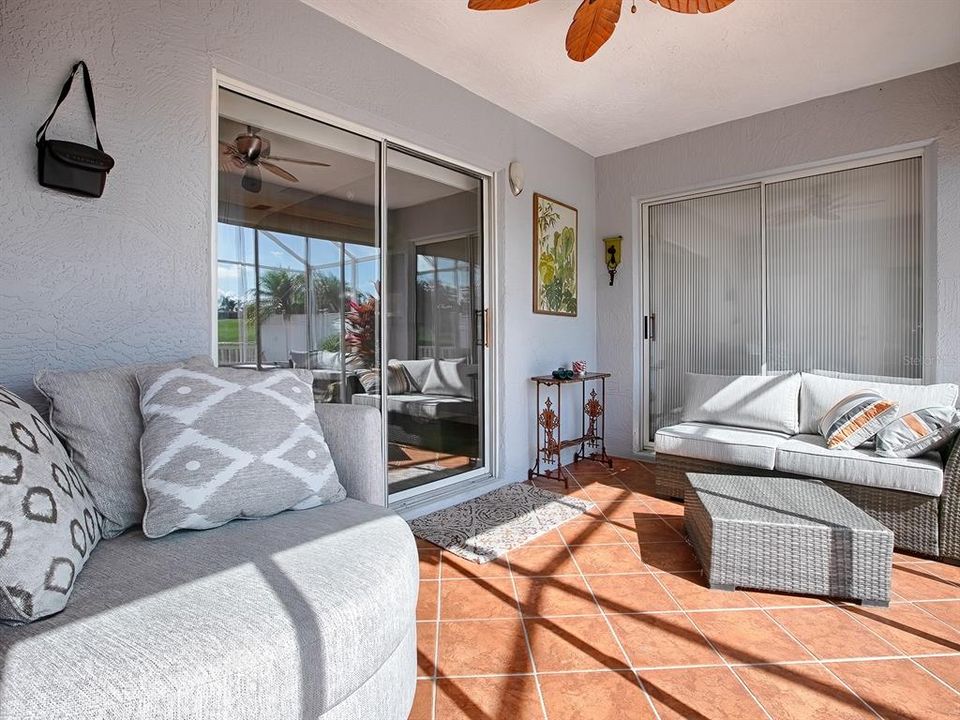 DIAGONAL TILE ON ENCLOSED LANAI WITH CEILING FAN.