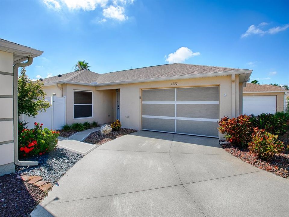 NOTICE THE REMOTE SCREENED DOOR ON THE GARAGE.  YOU CAN SEE OUT BUT NO ONE CAN SEE IN.  GREAT FOR AIR FLOW.