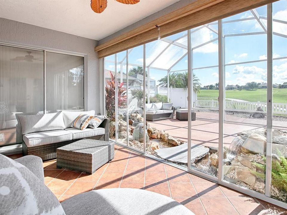 THE SLIDING GLASS DOORS BEHIND THE LOVESEAT IS THE PRIMARY BEDROOM. SUNSHADES TOO!