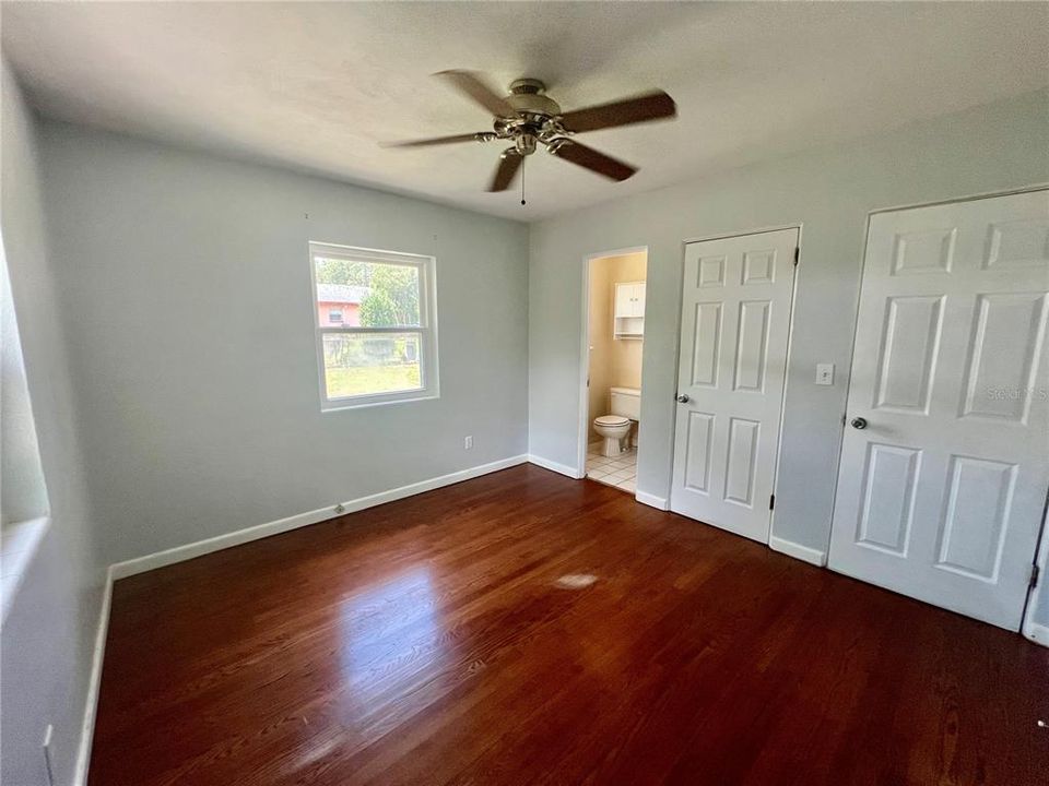 Primary bedroom with half bath