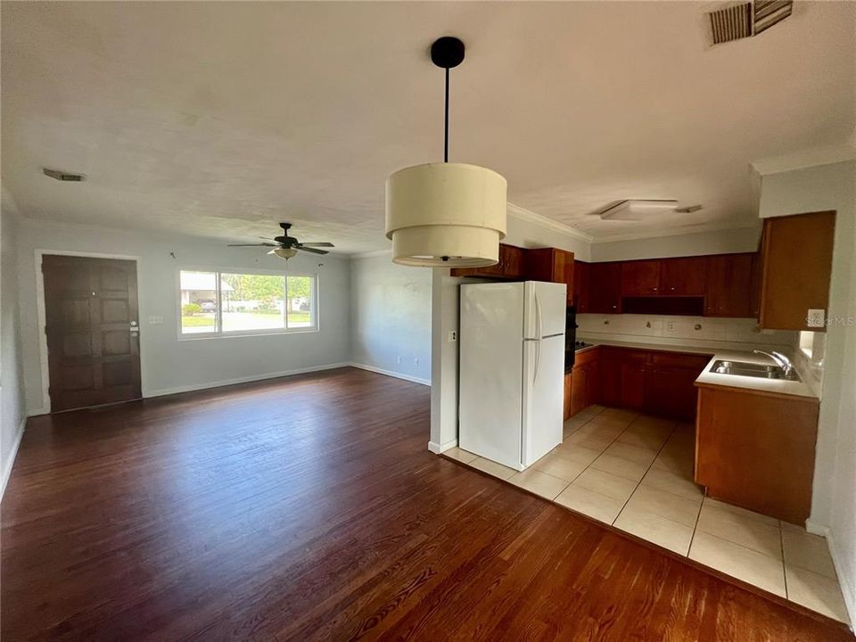 Looking into living room and kitchen from dining area