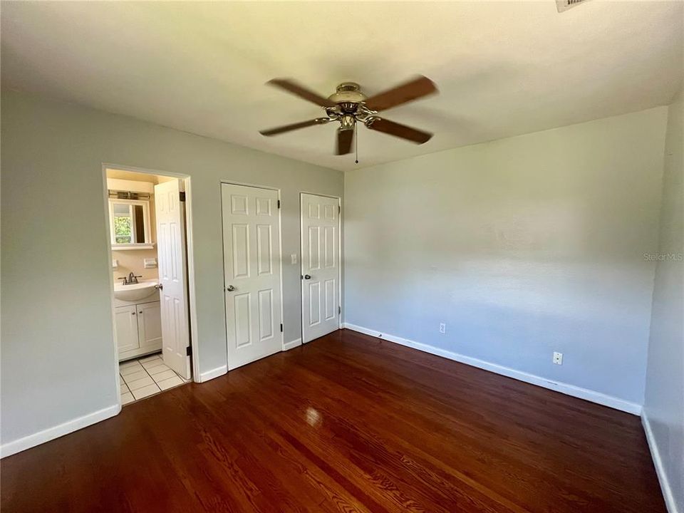 Primary bedroom with half bath