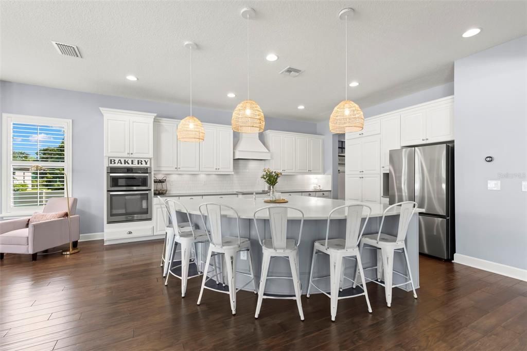 Gorgeous kitchen with a breakfast bar with enough room to seat 6