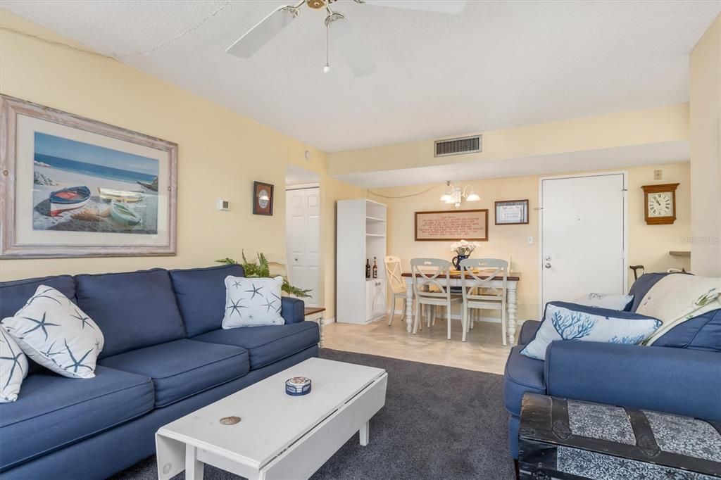 Living room and dining area. Light colors and coastal living.