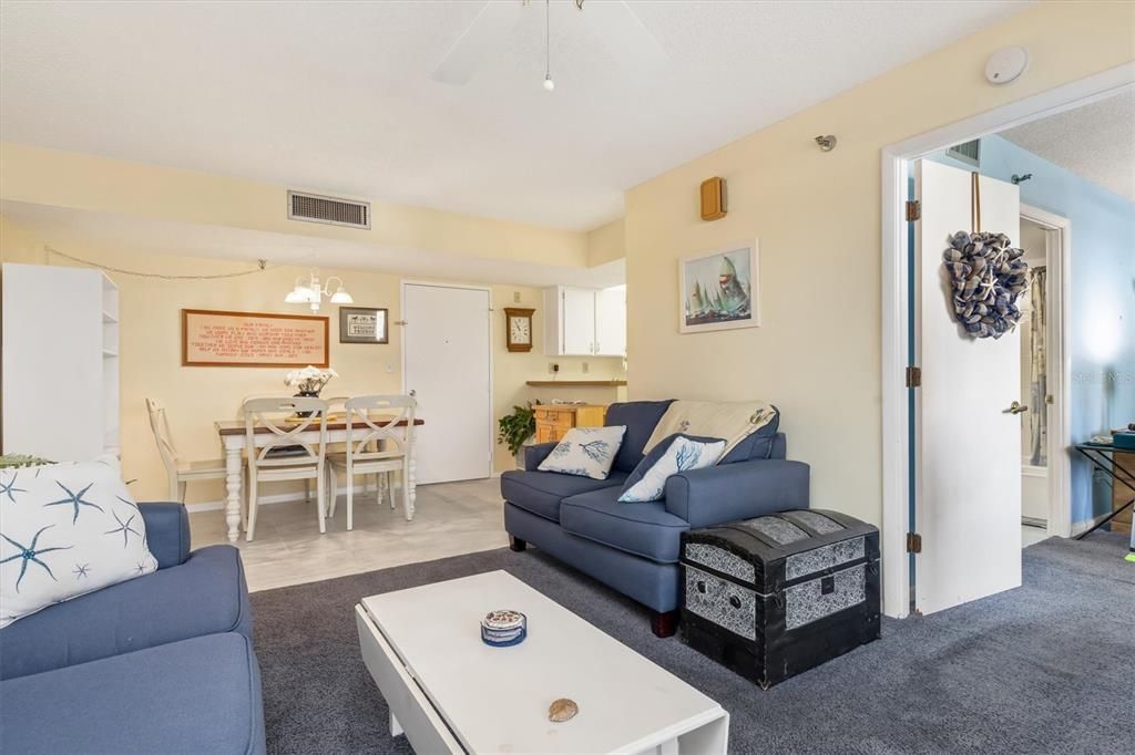 Living room with door to Primary bedroom