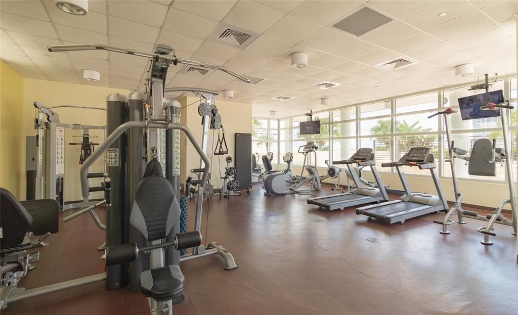 Fitness center located on the 9th floor next to pool and hot tub.