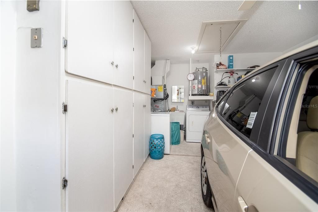 Garage with built in Shelves, Washer, Dryer and Utility Sink