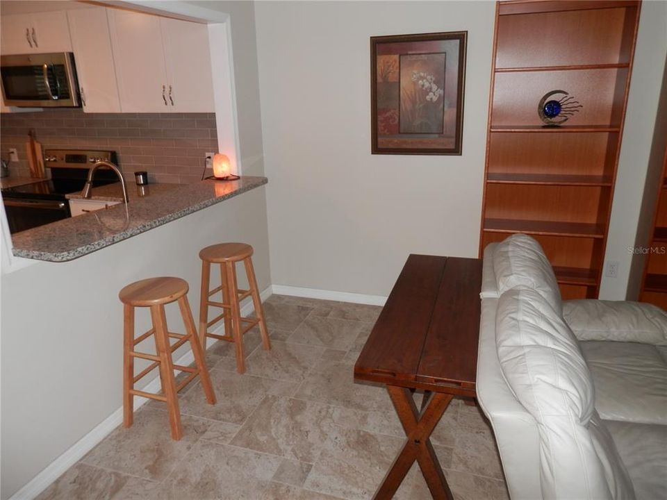 LARGE BREAKFAST BAR OPEN TO KITCHEN