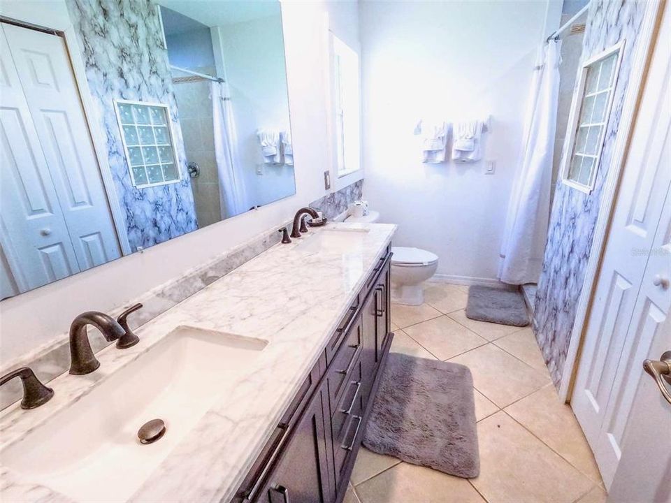 Large bathroom with gorgeous countertop