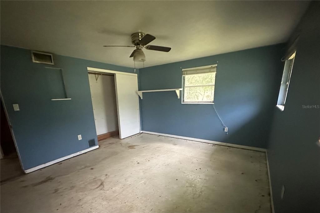 Primary bedroom.  Terrazzo flooring.