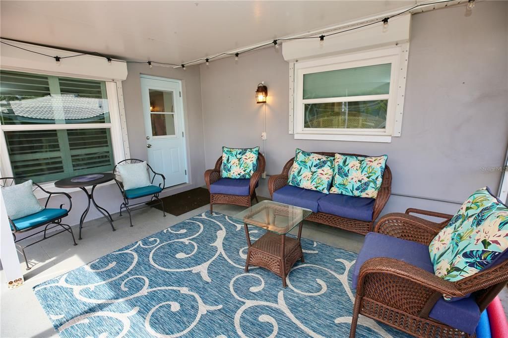 Large seating area on pool patio