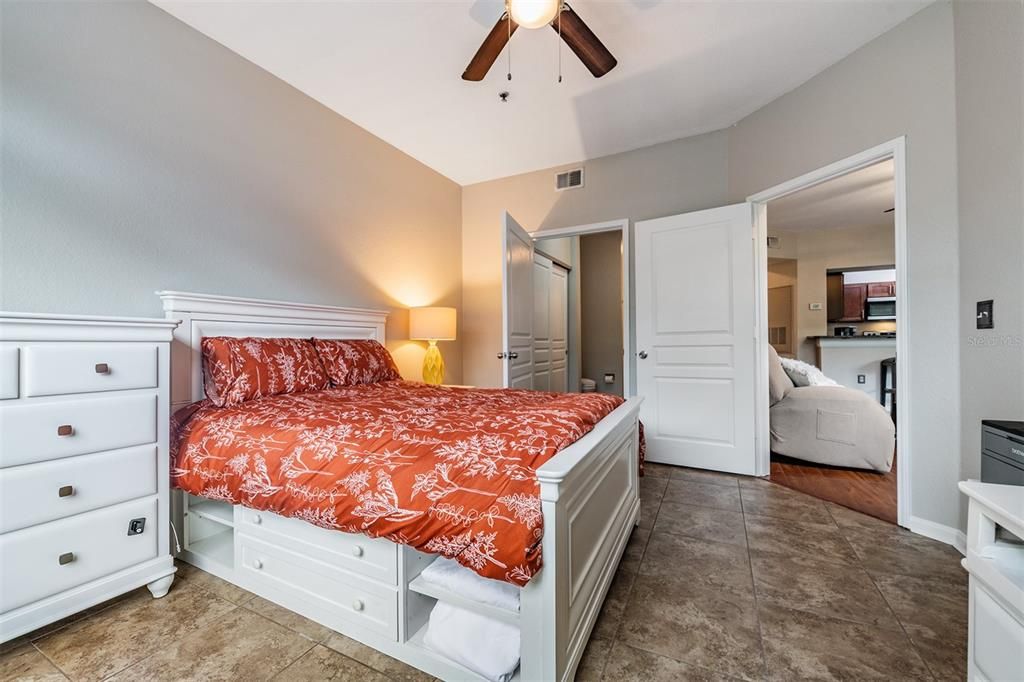 Guest Bedroom with new flooring, ceiling fan with light.