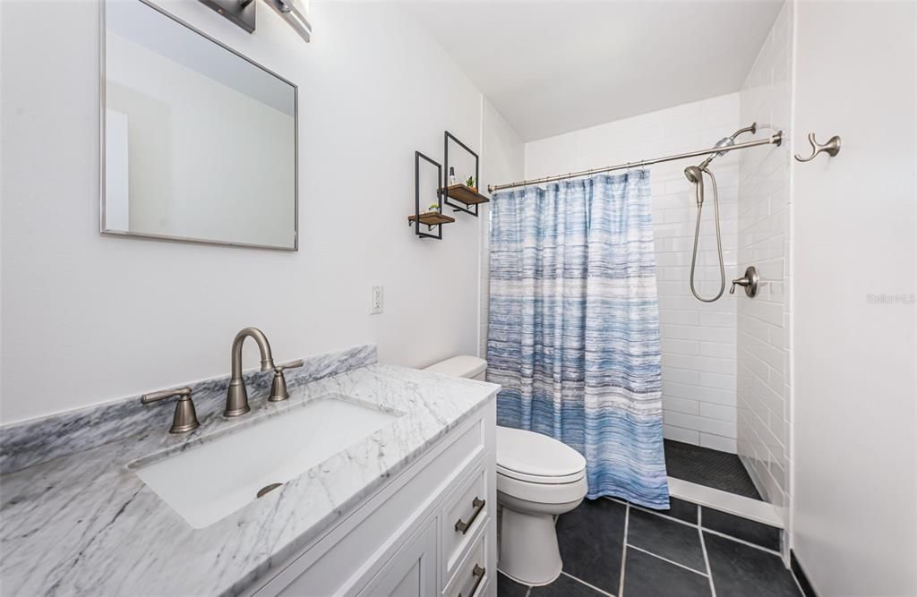 Main level full bath adjacent to the bedroom