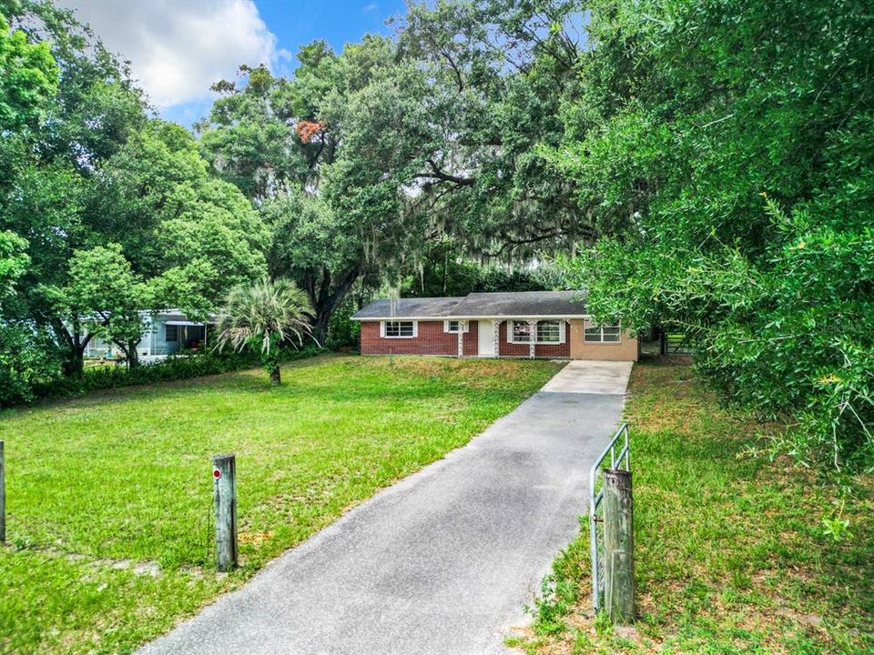 gated driveway and yard in front