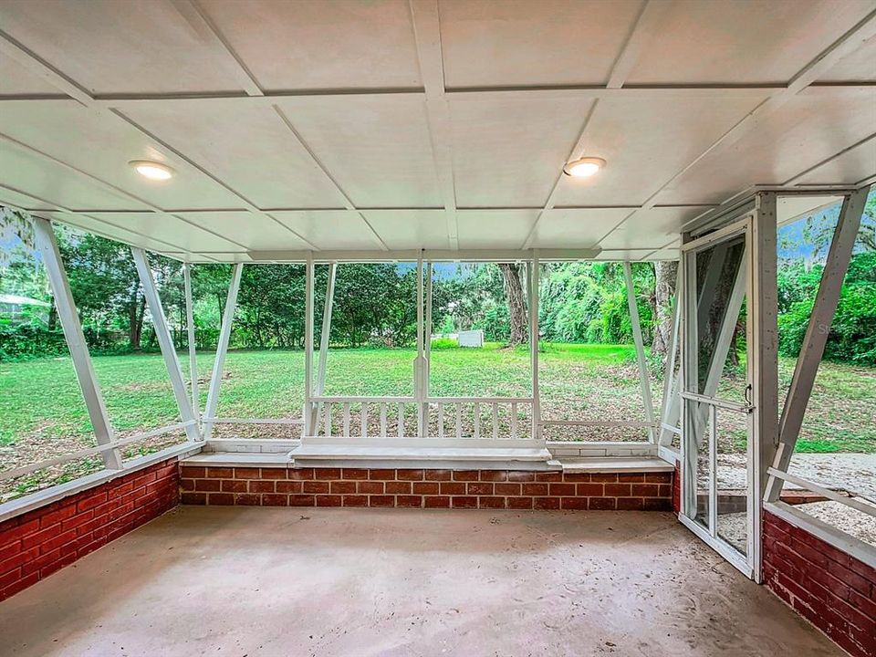 covered and screened back porch