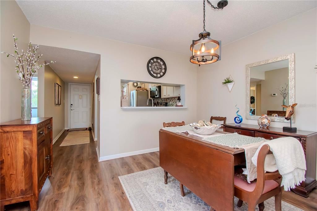 Dining area looking toward front entrance and kitchen