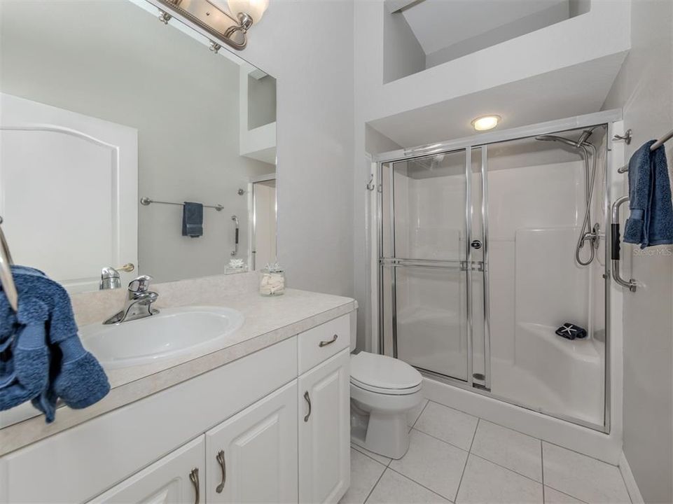 The master bath is well adorned with a beautiful glass enclosure