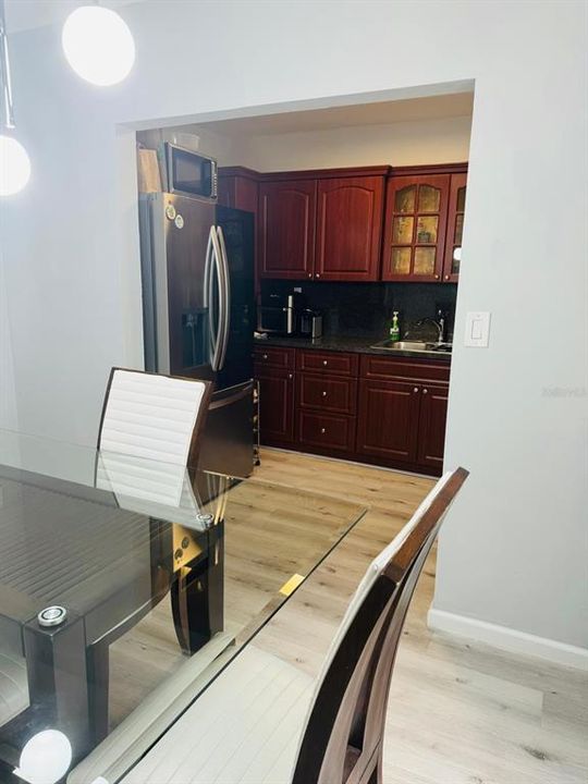 Dining room leading to kitchen