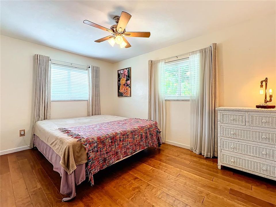 Guest bedroom with two windows for abundant natural light