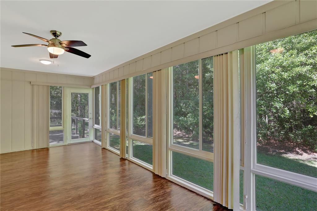 Enclosed Florida room windows that allow an amazing view and so much natural light!