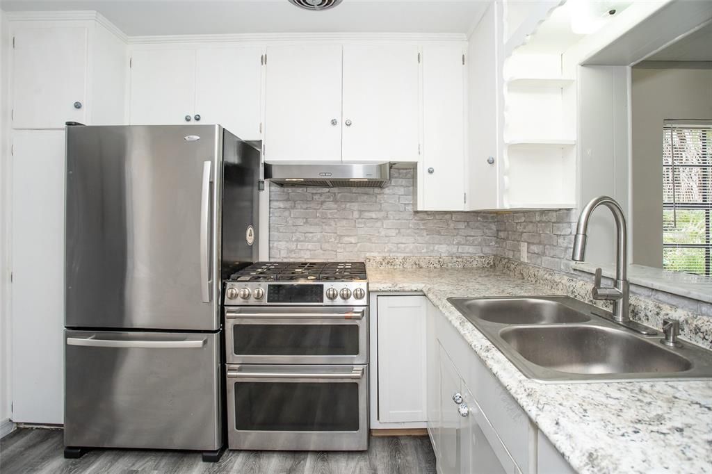 The kitchen has plenty of cabinet space including a corner lazy susan.