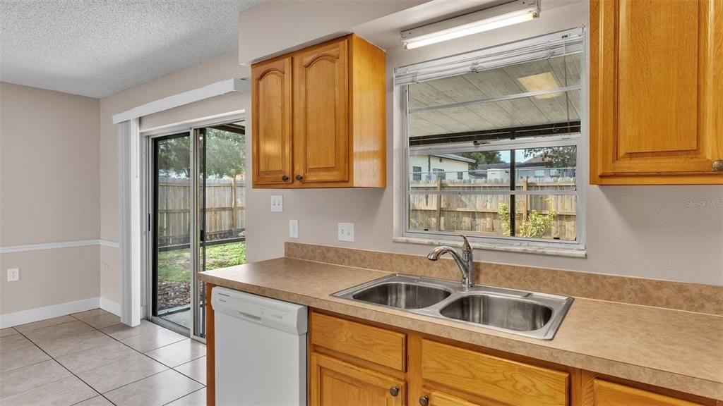 Kitchen area with Sliding Glass Doors to Screen Patio