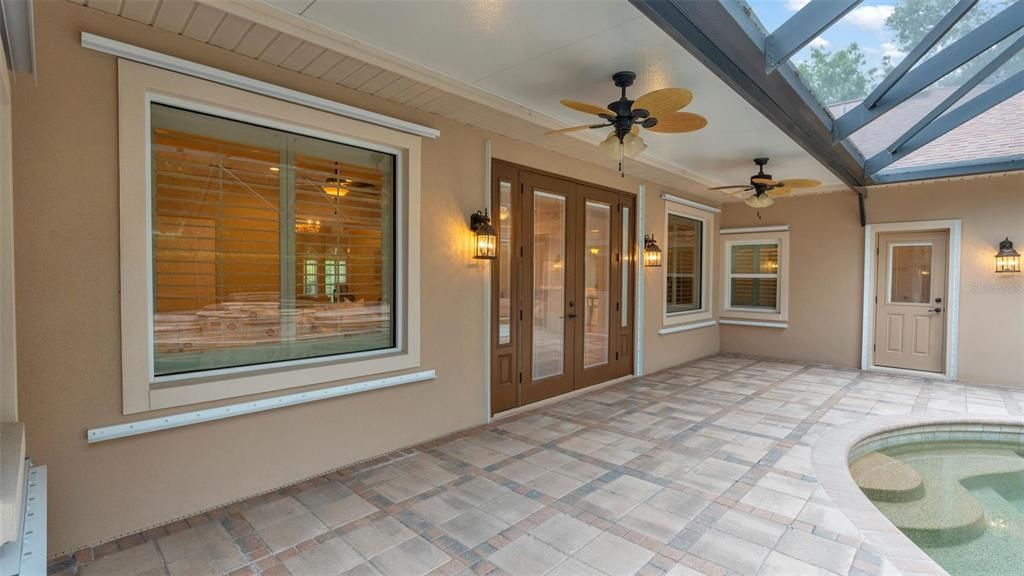 French Doors to the Great Room and Door to the Pool/Guest Bath.