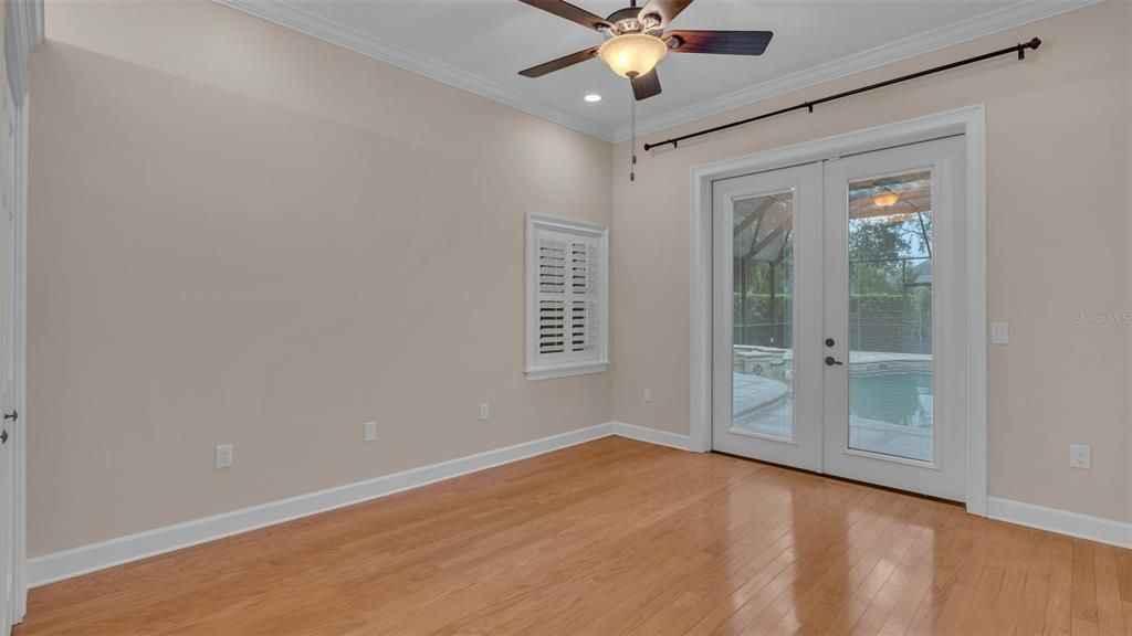 Bedroom Four with French Doors to Pool Area