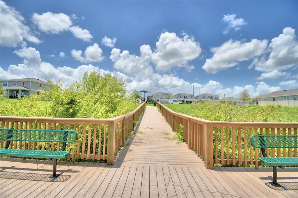 seating areas on pedestrian dock overlooking the lake