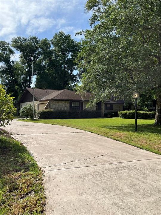 Looking up driveway toward side load garage