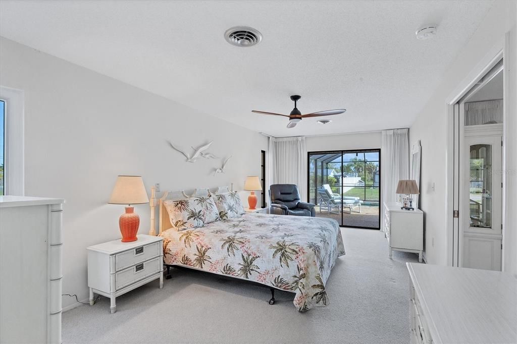Master Suite overlooks pool & offers direct access